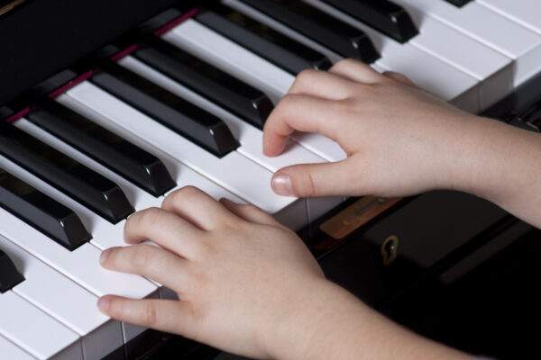 Piano,Playing,Hands,Of,A,Child