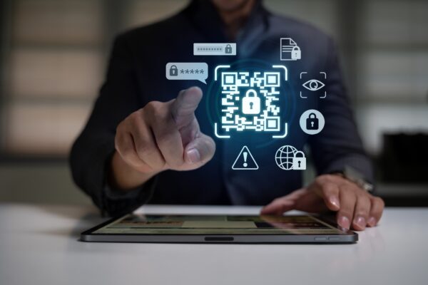 Digital,Security,Concept,With,Hand,Pointing,At,Glowing,Qr,Code